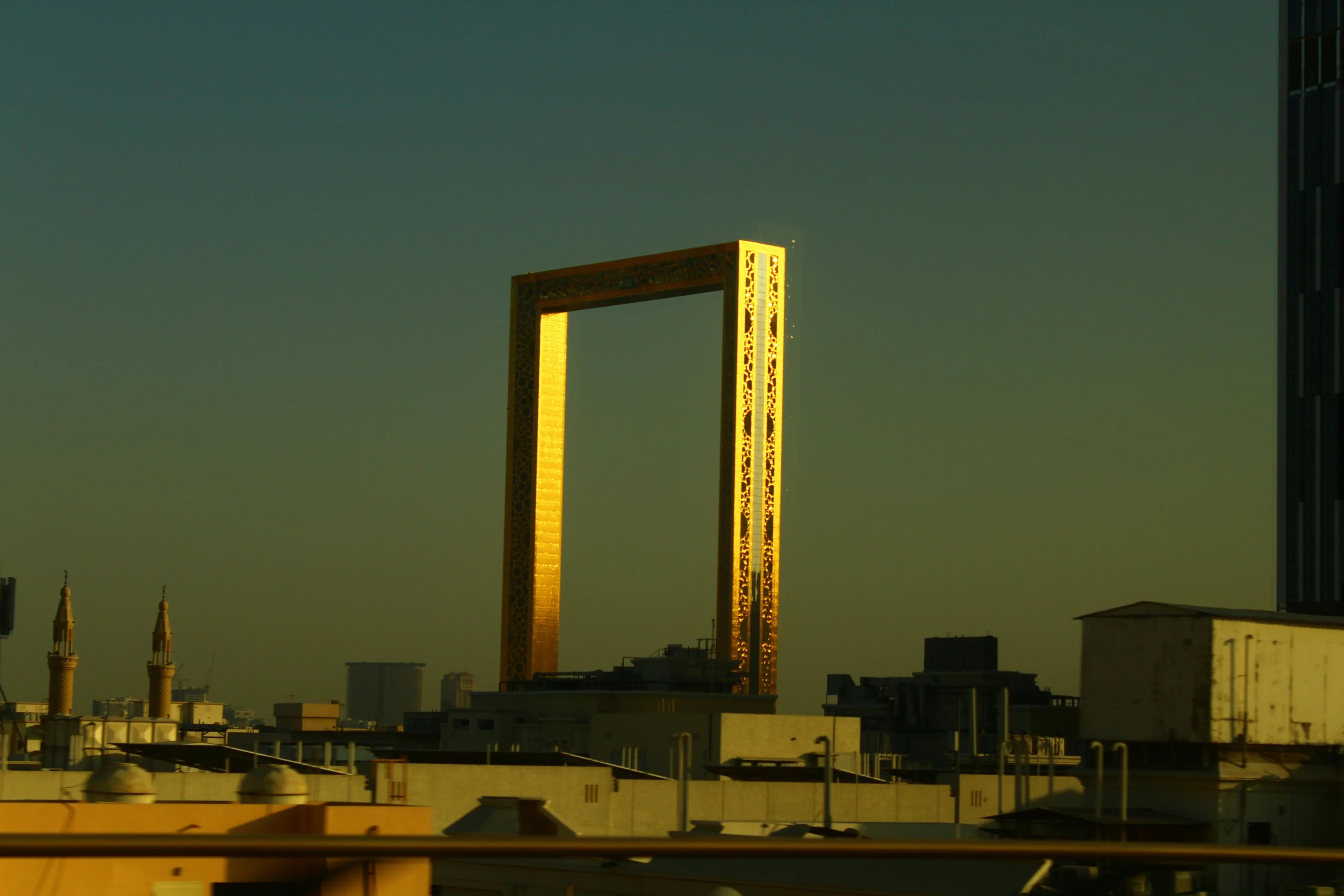 Dubai Frame lit gold at golden hour