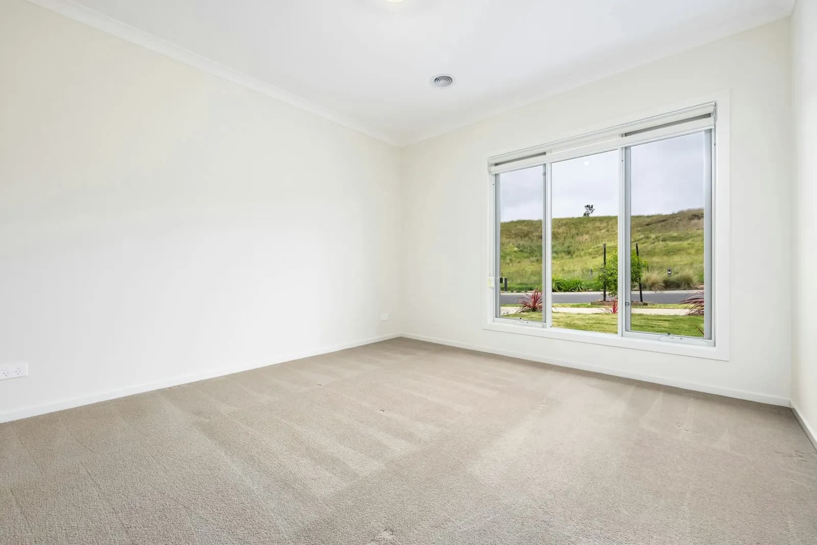 Empty newly finished apartment bedroom ready for handover