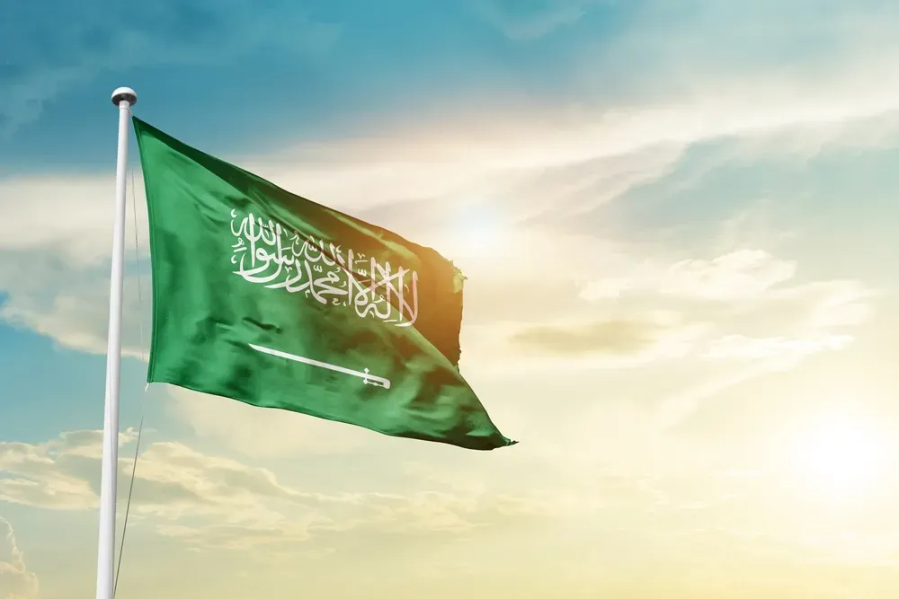 Saudi Arabia national flag representing Saudi investors planning investment in Dubai real estate