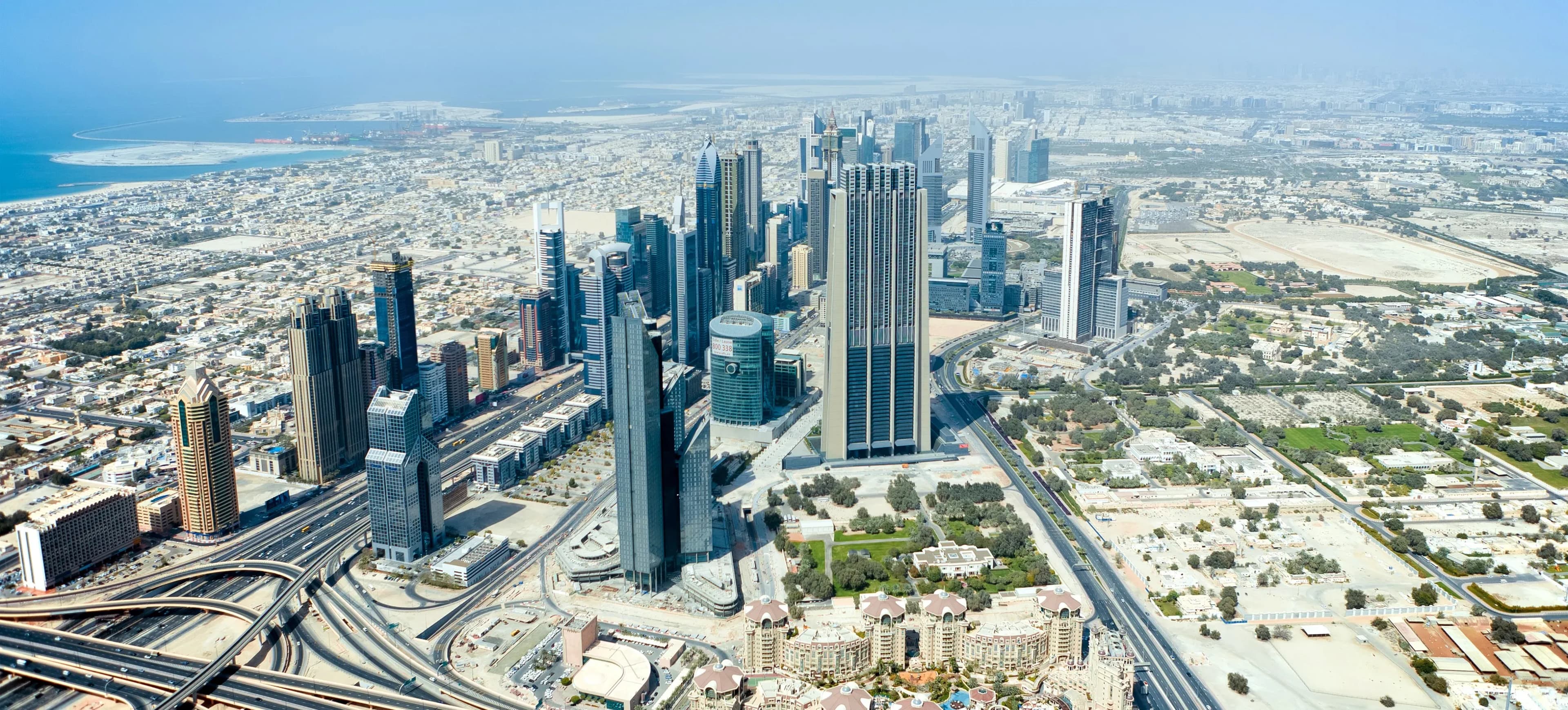Aerial view of Dubai city highlighting residential and commercial developments managed through Dubai property management